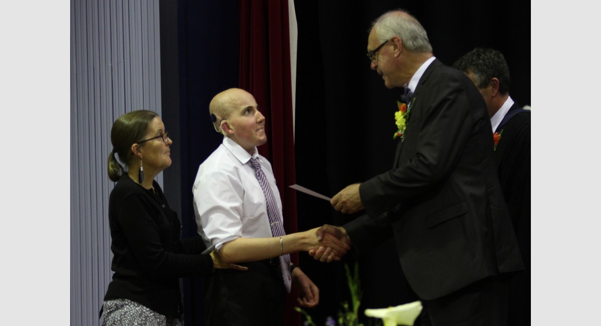 IHS Snr Prizegiving 2020 Rory 2 Handshake